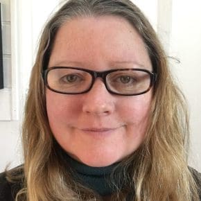 Photo of Heidi Ball, Professional Writing Academy Moderator, long mousy brown hair and glasses.